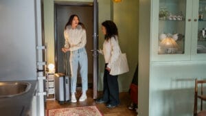 two girls entering in a room