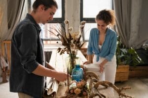 man and woman decorating their home